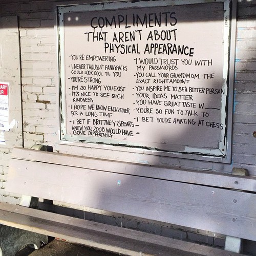 Photograph of graffiti listing compliments that aren't about physical appearance.
