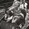 Archival photo of women laughing on rollercoaster