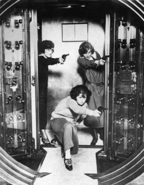 Employees practice protecting the vault of a strong room at a bank. Via tumblr.